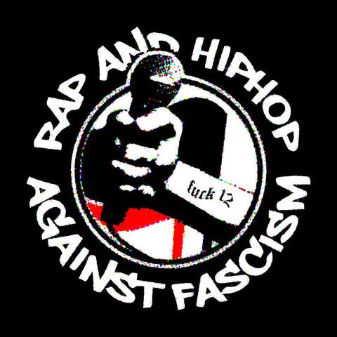 Antifascist logo style that reads: "Rap and Hip Hop Against Fascism", with a fist holding a microphone on top of a black and red flags.