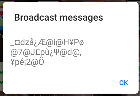 An alert screen with a heading of "Broadcast messages" and a lot of what looks like wrong countrycode glyphs