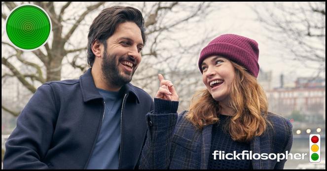 Shazad Latif and Lily James in a still from What's Love Got to Do with It?, with a Flick Filosopher green-light icon meaning See It