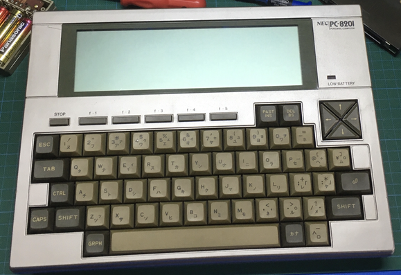 NEC PC-8201 laptop computer. It's a keyboard with a monochrome LCD screen above it.