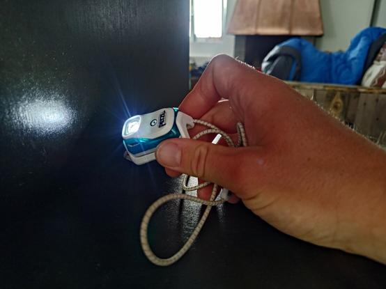 My holdin the headtorch which is still shining.