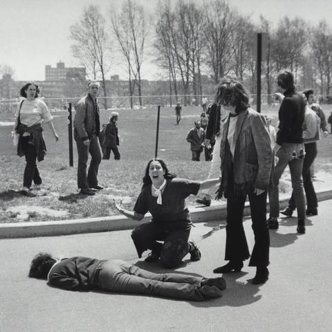 Mary Ann Vecchio gestures and screams as she kneels by the body of a student lying face down on the campus of Kent State University on May 4, 1970.