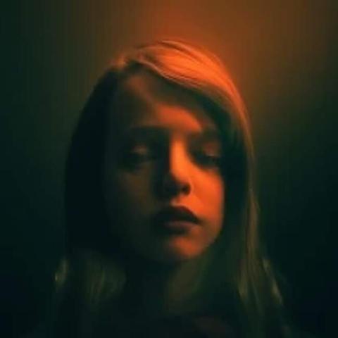 ai impression of caption 'somnium ep by ambient musician autumna' showing a young human with eyes closed