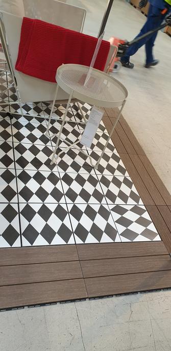 Floor tiles with oblong lozenges pattern - one of the tiles is put in the opposite direction towards all the other.