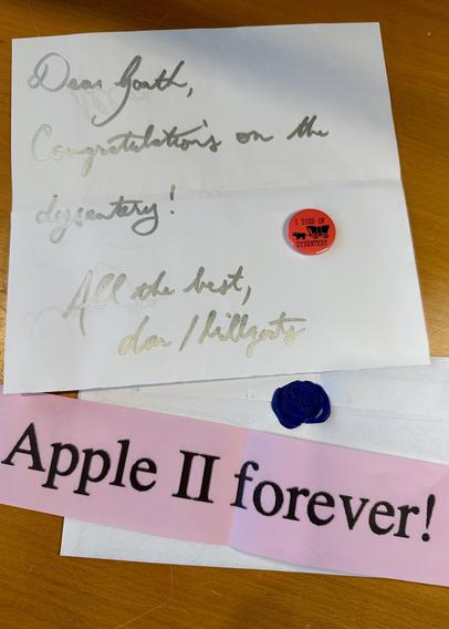 A wonderful hand written letter congratulating me on the dysentery and a small banner that reads “Apple II forever!”