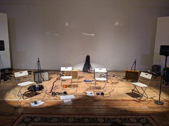 Empty folding chairs and amps l.
