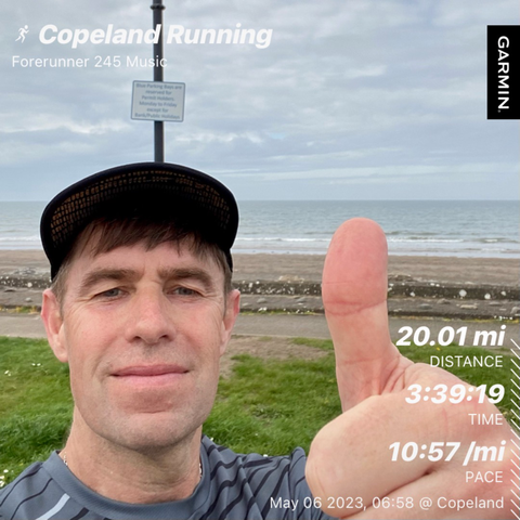Me with a beach in the background and Garmin stats displayed.