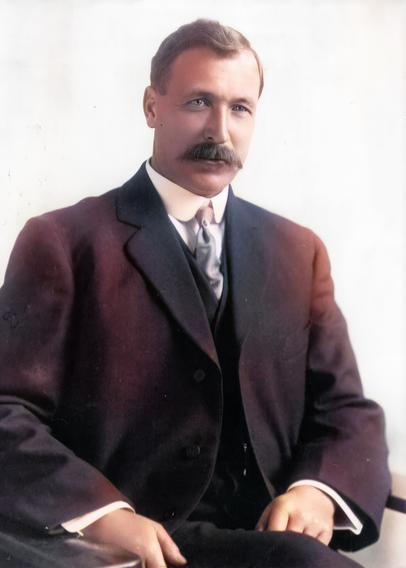 Captain Grant Sitting in a chair with hands on his lap.