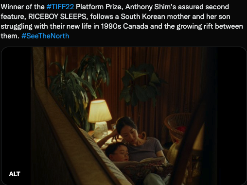 Screenshot of a film Riceboy Sleeps. Shows a mother reading to her son.