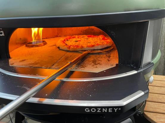 Pizza cooking in oven