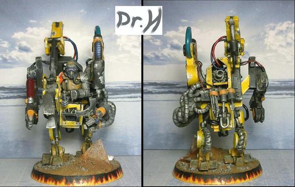 Front and rear views of The Mechanic.
The upper torso of a humanoid sits atop robotic legs, surrounded by robot arms.