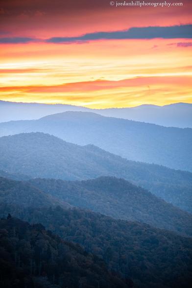 Dawn awakens to a blaze of colors in the Smoky Mountains.