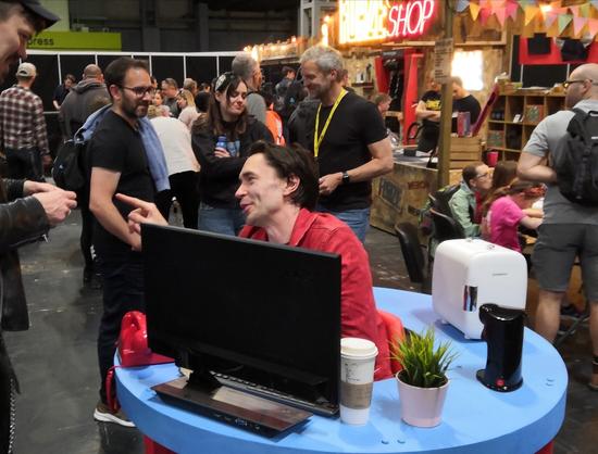 Shawn in KidsInventStuff invention - mobile desk. Behind Ruth Amos, Matt Denton, Ivan Miranda