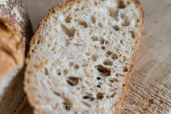 Close-up of the open crumb of a rustic country bread.