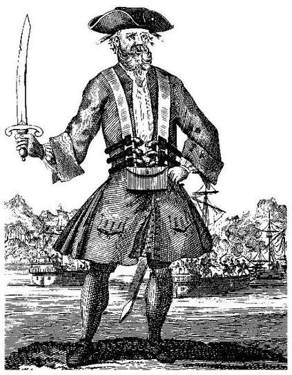 A woodcut illustration of an 18th century pirate holding a cutlass in his right hand.  Burning ships in the background.