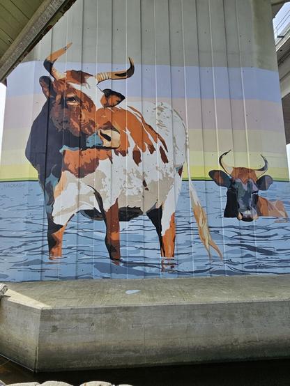 Painted on the vertical support piles of a large bridge, cattle wade in shallow water.