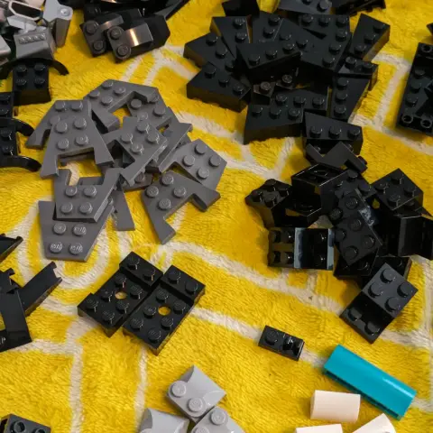 A variety of black and grey LEGO pieces