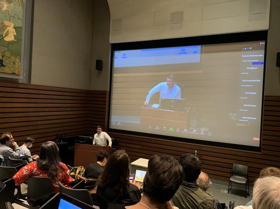 Fenwick on Stage in lecture hall kicking off the symposium