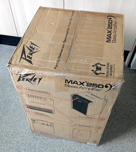 A still boxed Peavey MAX250 bass amplifier.