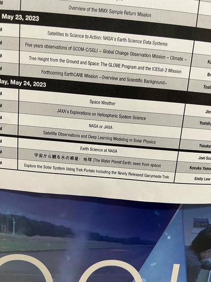 Photograph of a print out of talks that will be held at the giant display (hyperwall) at the JpGU conference. Under events listed as “space weather” and “JAXA’s Explorations on Heliospheric System Science” is an event simply entitled “NASA or JAXA”.