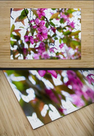 A screenshot of a puzzle mockup featuring Stained Glass, a pink crabapple blossom photo. The header reads Sublimation High-Gloss Jigsaw Puzzle Print. The puzzle mockup is atop a light colored wood surface. There is also a close-up of the puzzle's lower left corner, showing the detail and shape of some of the pieces.