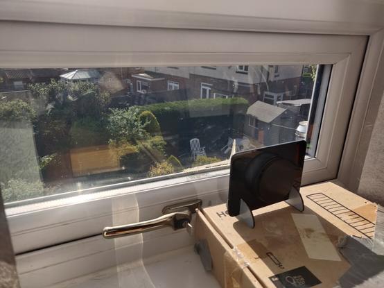 A Solarcan in a holder on a Windows