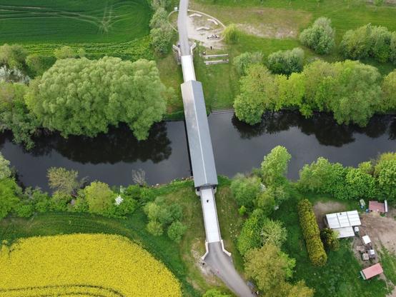 The bridge photographed from a ninety-degree angle straight down. Now only the grey tiled roof of the bridge is visible.