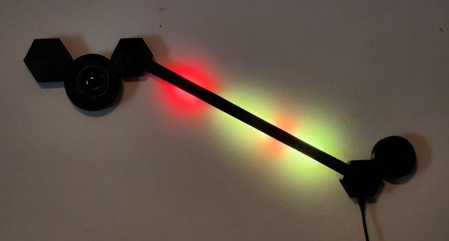 A black wled lamp with several added nodes including a speaker. Stripes of red, yellow and green indicate the feline proximity to various #bigear sensors