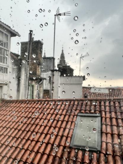 View of Santiago de Compostela from a window with rain drops
