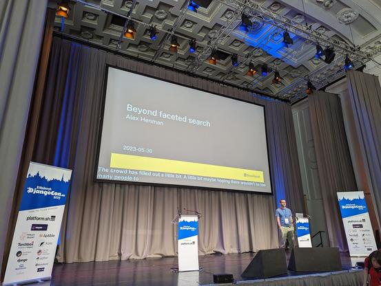 Alex Henman on the stage of the DjangoCon Europe 2023
