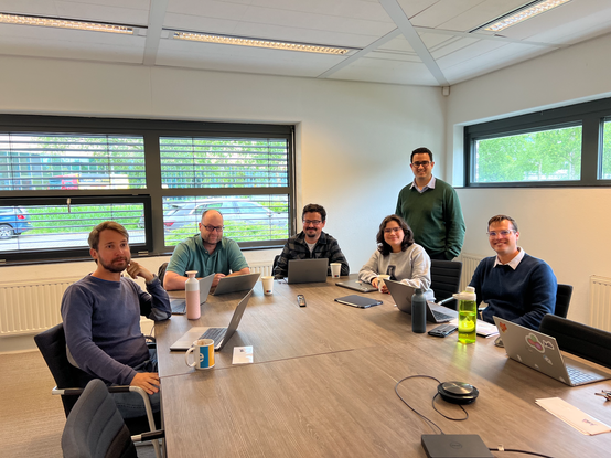 Our colleagues sitting around the table, working hard!