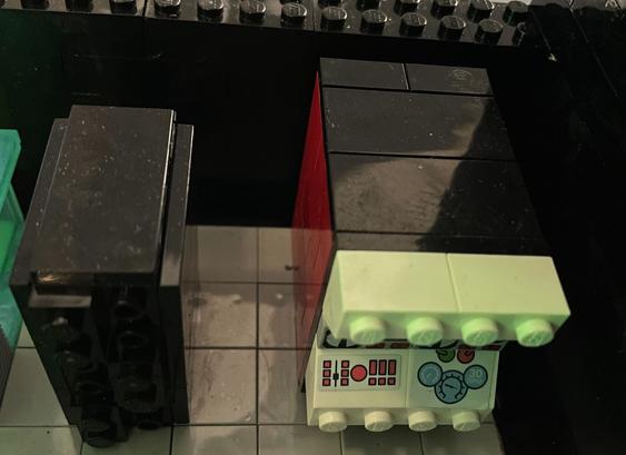 Two Lego models, one is a black rectangle representing the IBM z16 mainframe, and a second that's an IBM System/360, the first of this architecture, released in 1964.