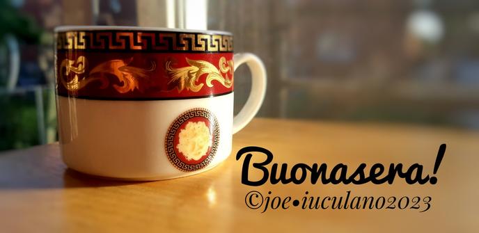 Cup of espresso, the word "Buonasera", italian for Good Evening