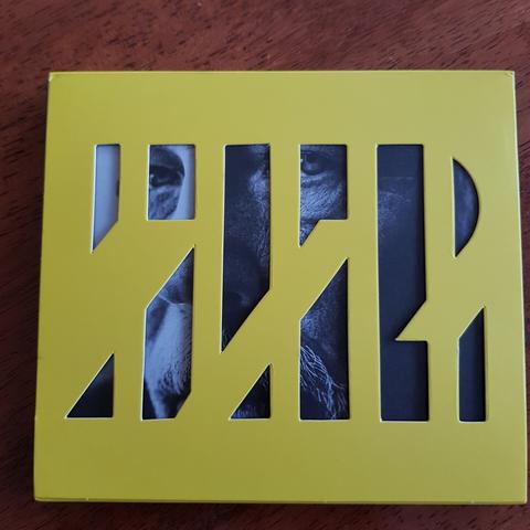 Back cover of new Metallica album 72 Seasons, featuring a stylised number 72, with panels cut out revealing the face of lead singer James Hetfield on the inside sleeve.