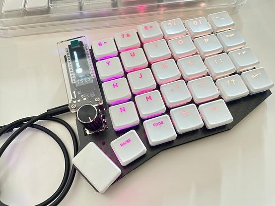 Photo of the right half of the keyboard with the RGB lights on