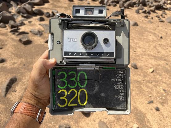 The folded but open land 320 with the manual and cold clip stored in the inside of the case.