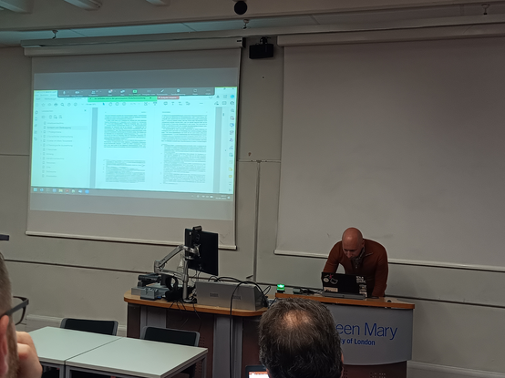 Martin demonstrating a PDF that has been created by a docx→BITS→LaTeX→PDF conversion for Dutch publisher Brill. The spread (double page) contains many footnotes.