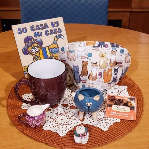 Comical cats feature in this tea tableau. The tea is Rooibos Chai from Numi.