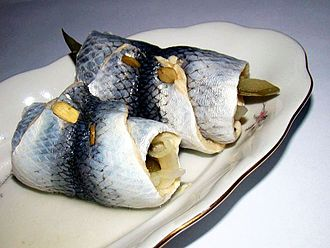 Picture of rollmops taken from Wikipedia.

A pun on the verb "to roll", the acronym for Large Language Models (aka "LLMs") and the "Ops" shortcut to refer to the operations team.