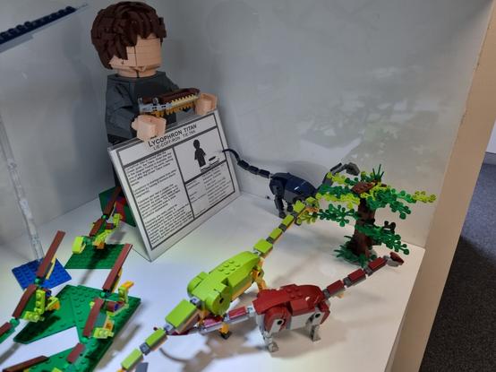 Lycophron titan sclaed to the mega fig its being held by. Wintonotitan (dark red), Australotitan (lime) and Diamantinasaurus (dark blue) scaled to the tan microfig.