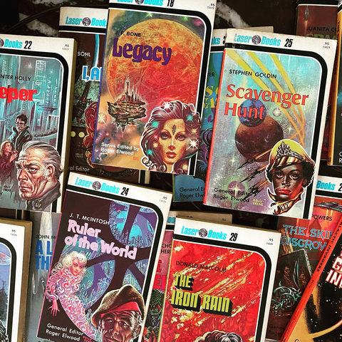 Scattered collection of science fiction paperbacks, all with the Laser Books imprint at the top