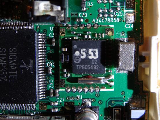 Close up of mystery component with white paint on it that says ". 5 53", maybe it's supposed to read as 0.553?
The only fully visible text is TPG05492.