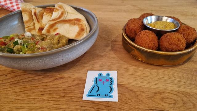 A plate of bitterballen, the lobotomized owl selector sticker in front