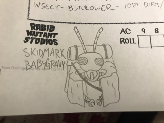 a mantis man wearing a large backpack over a cloak.