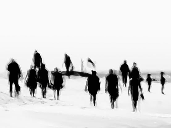 A high contrast black and white image of people walking on the beach. People's silhouettes are black and blurred by intentional camera movements. The background is almost completely white, only hints of traces in the sand can be seen.