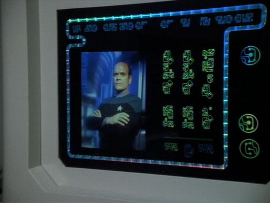 Plaque of the Dr hologram in an alien museum.