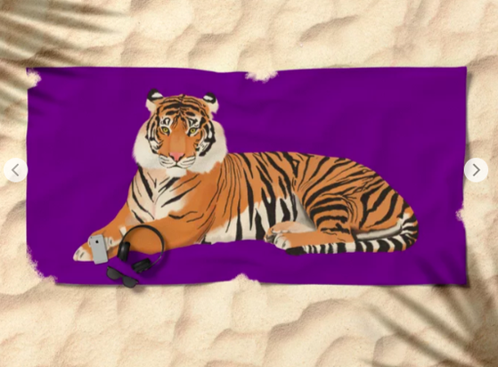 Our tiger mascot is shown with a purple background on a beach towel.