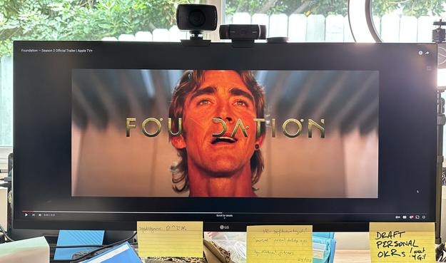 Photo of a 2.35:1 format video letterboxed (black bars top and bottom) into a 16:9 video frame, then “full screen” on YouTube which further insets the video by pillarboxing (adding black bars left and right), so there is a thick black border surrounding the video on all sides, and it’s not full screen at all.