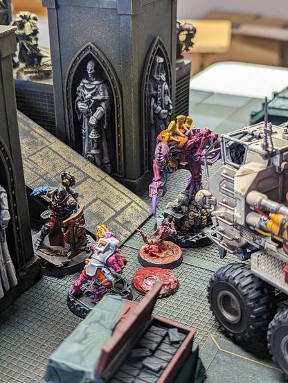 A tabletop skirmish wargame in progress.