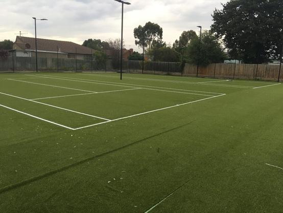 A new double tennis court with sand filled artificial turf installed at Charles Mutton Reserve, Fawkner, part of Merribek municipality in Melbourne, April 2023.
